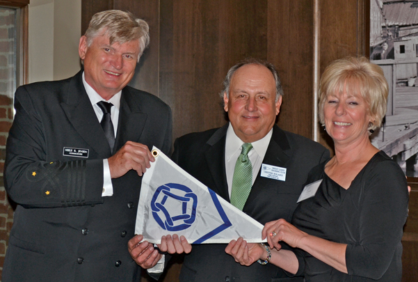 2014: Past Commodore Niels Jensen presented 25-year Member Port Captain burgee to Port Captains Chester and Ceann Kolascz